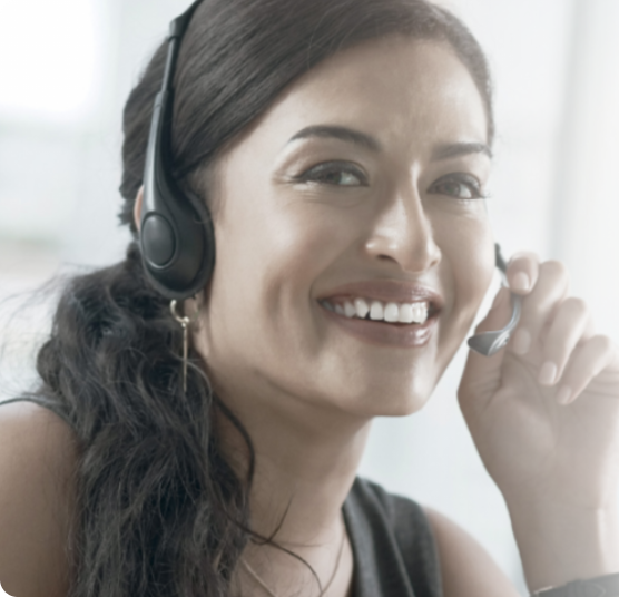 Customer service employee smiling with a headset on