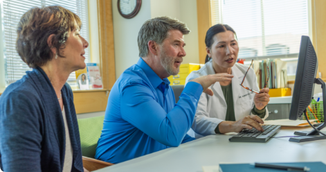 Older patient and caregiver signing up for Vyndacares, a program that provides helpful information about ATTR-CM and VYNDAMAX (tafamidis). See safety info.