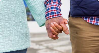 A couple holding hands who might benefit from joining an ATTR-CM advocacy group where they can get support from other patients