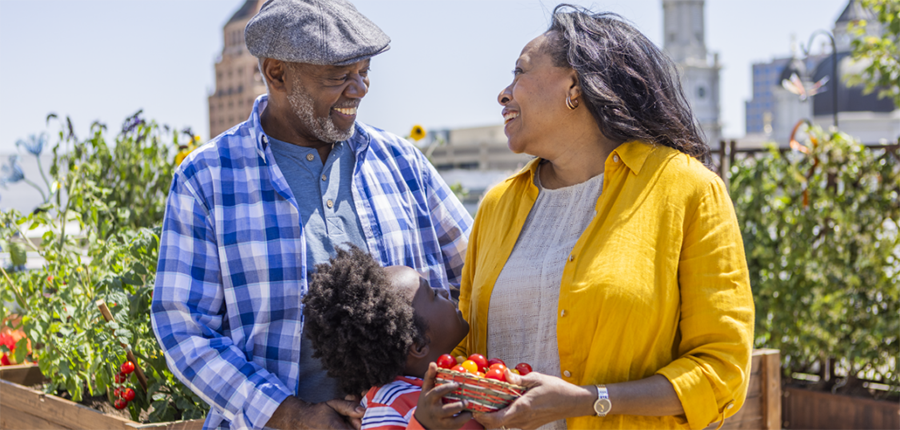 An older couple with their grandchild enjoying the outdoors