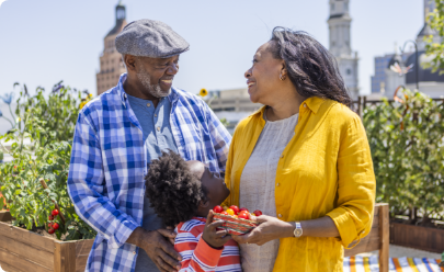 An older couple with their grandchild enjoying the outdoors