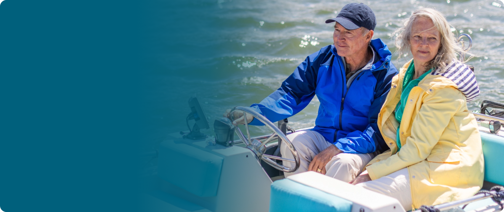 Actor portrayal of an older adult couple on a boat