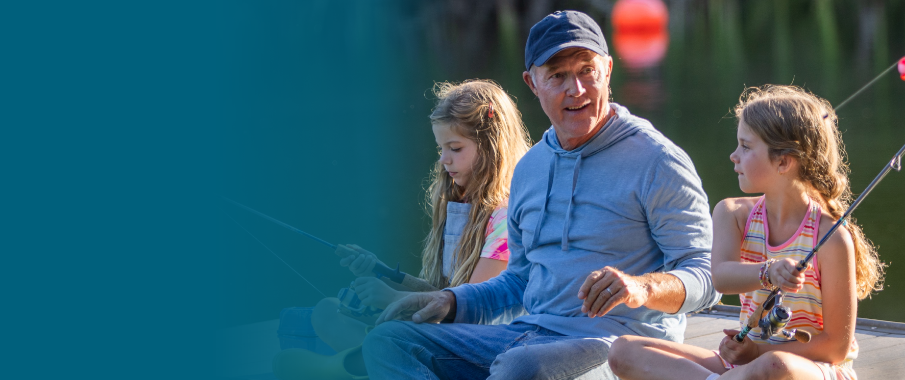 Actor portrayal of a grandfather fishing with his granddaughters