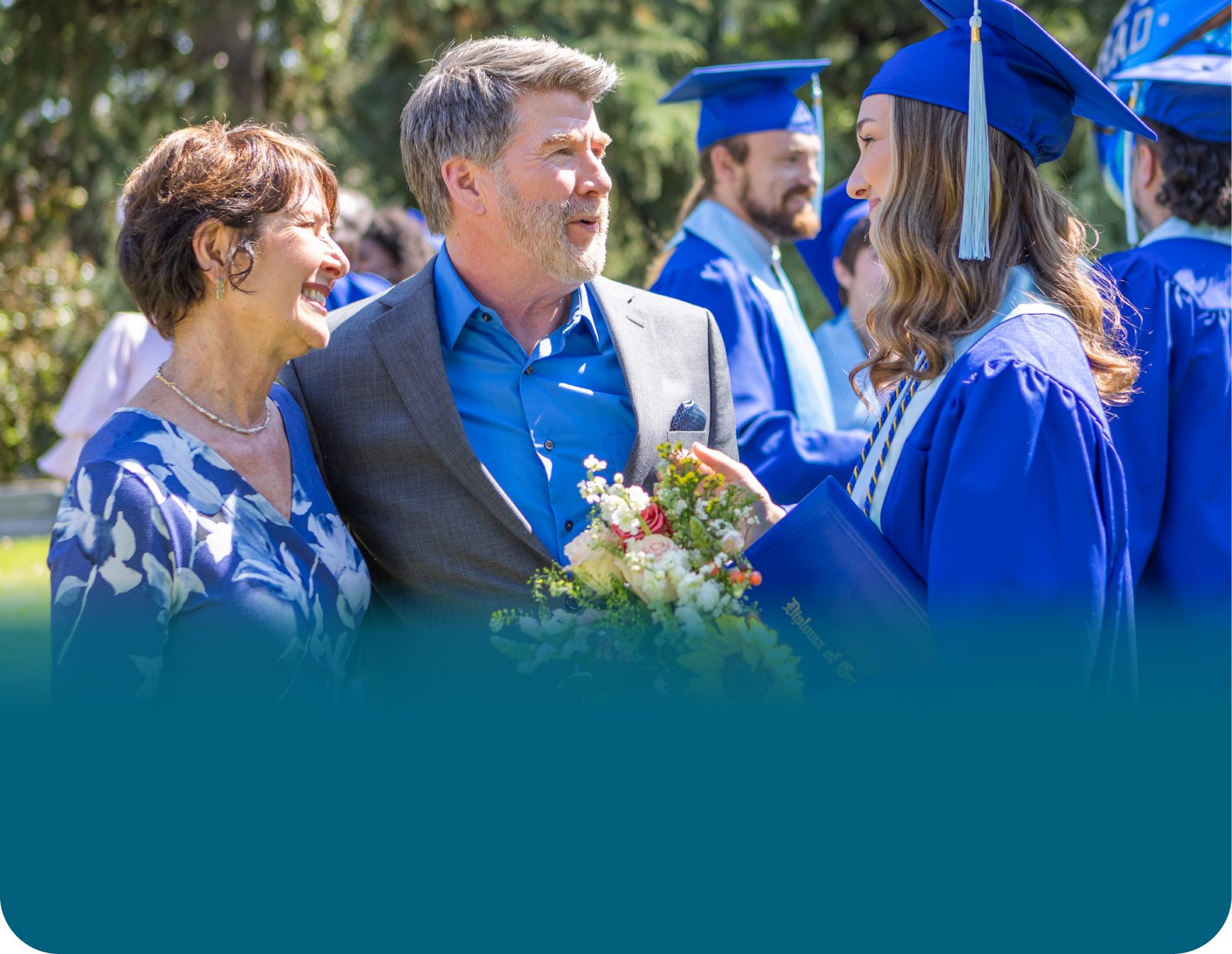 Actor portrayal of a family engaging in conversation at their daughter's graduation