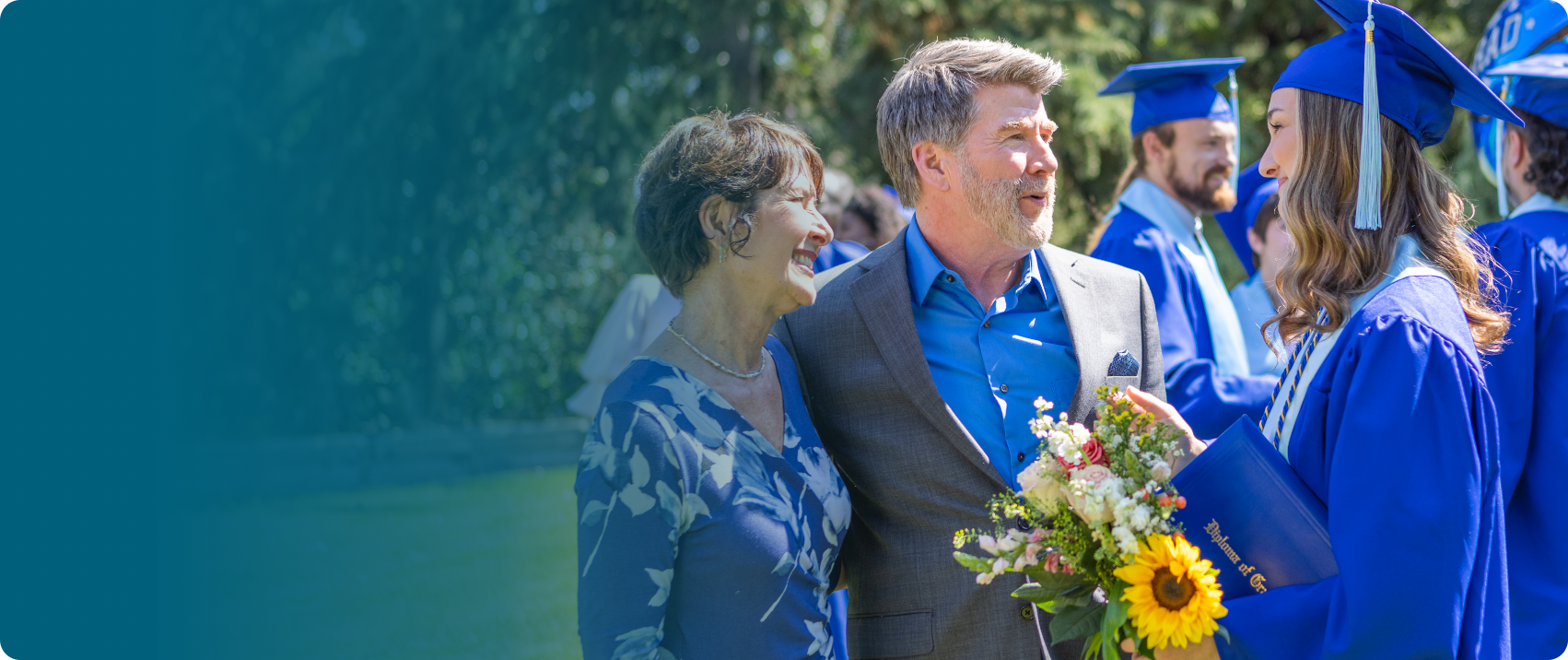 Actor portrayal of a family engaging in conversation at their daughter's graduation