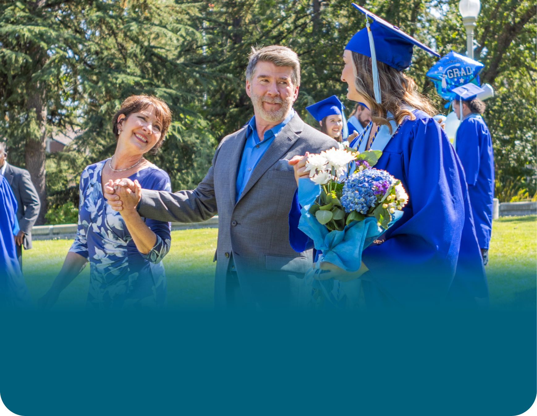 Actor portrayal of a family strolling together at their daughter's graduation